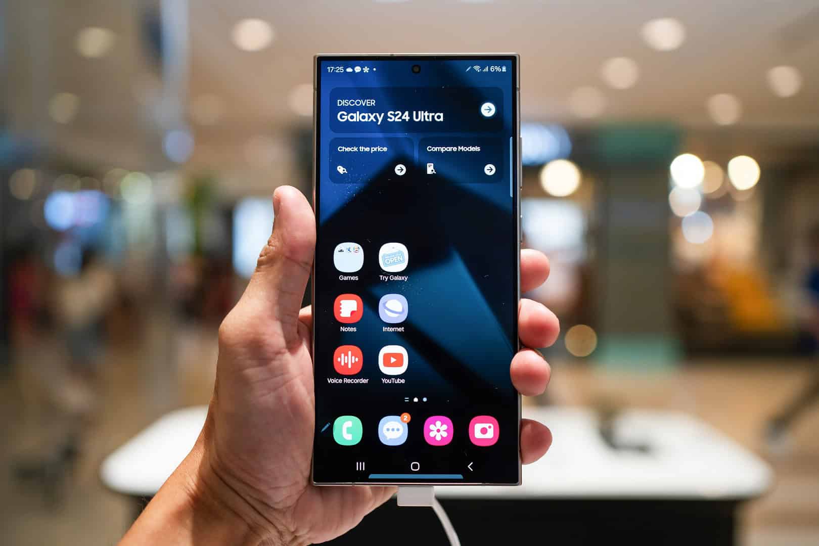 Macro shot of a high-end smartphone screen edge displaying a glowing, minimalist neon green circular indicator light against a dark, sleek glass surface. The background features abstract, out-of-focus digital data streams and glowing blue c