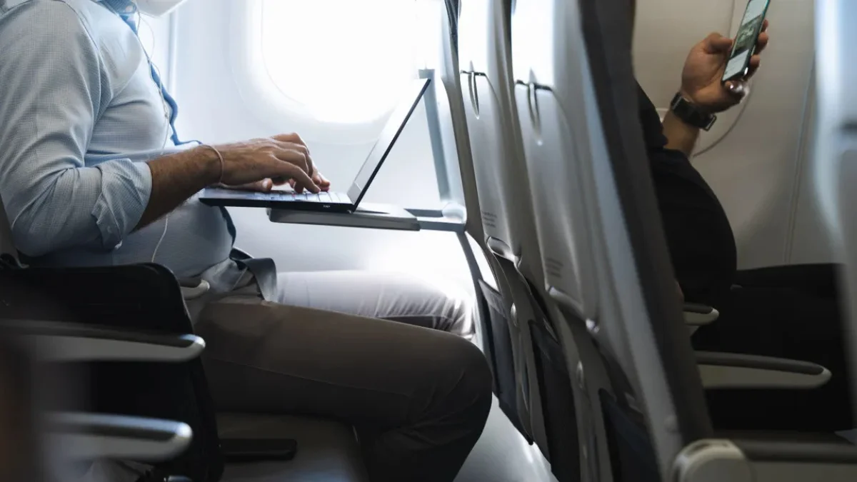 A sophisticated digital dashboard interface displaying abstract financial analytics, flowing data streams, and glowing neural network nodes connected to stylized travel reservation icons, dark mode aesthetic, vibrant blue accent lighting, s